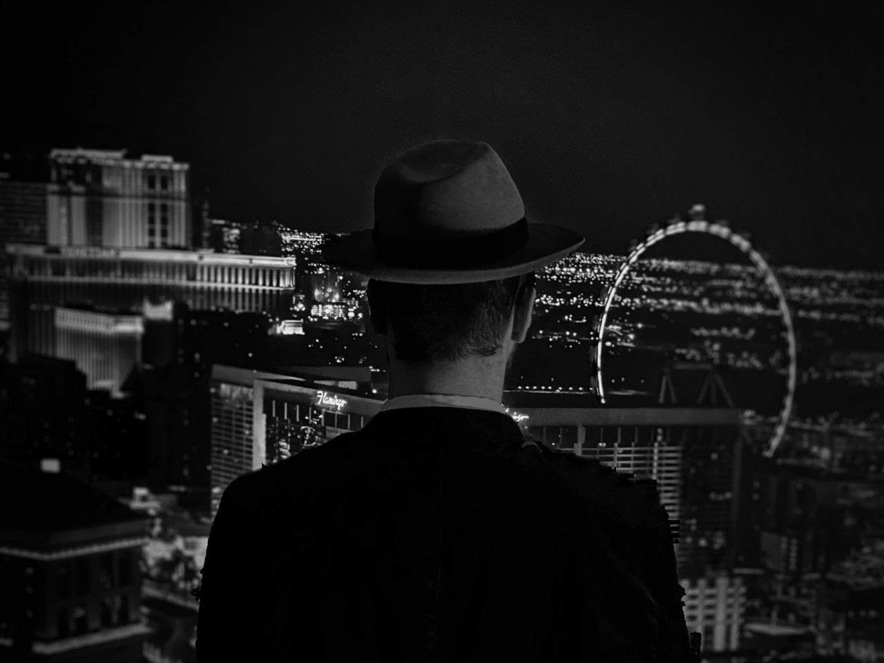 Eine Silhouette eines Mafiabosses mit Las Vegas im Hintergrund.